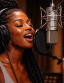 Artist recording vocals in studio